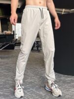 가을 겨울 피트니스 스포츠 캐주얼 팬츠 남성용 속건성 런닝 트레이닝 드로스트링 팬츠 슬림핏 포켓 지퍼 팬츠 트렌디 - 이미지 4