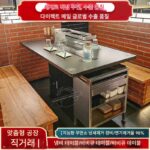 옛날에는 무연 스테인리스 스틸 바베큐 테이블이 상업용 배기 바베큐 테이블 아래에서 일체형 숯불 바베큐를 자동으로 뒤집습니다.