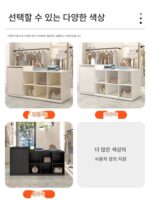 섬형 디스플레이 테이블은 심플한 모던 의류 매장 중앙에 배치되어 워터테이블 계산대 여성 의류 매장 카운터를 디스플레이합니다. - 이미지 4